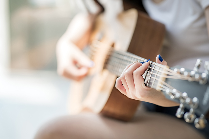 guitar-music-song-fingers-stock-getty.jpg